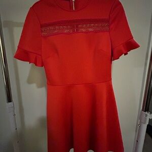 Ted Baker Vibrant red skater dress with lace accent.